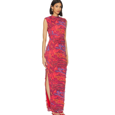 Woman wearing a red and blue patterned dress on a white background